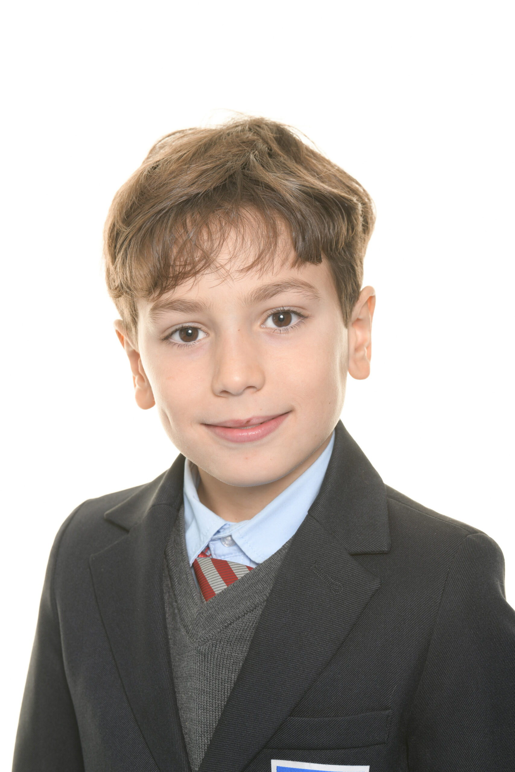 Retrato escolar de un alumno con americana y corbata